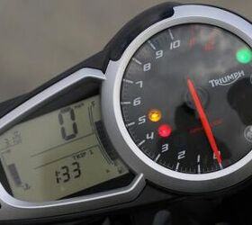 2012 triumph speed triple r review motorcycle com, An analog tachometer is paired with a digital speedo to relay important information Progressive blue shift lights atop the tach are a nice feature though we wonder why a gear position indicator as seen on the Daytona 675 and Street Triple isn t included