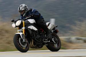 2012 triumph speed triple r review motorcycle com, No matter what you think of the quirky headlights that replace the iconic bug eye lights of the past their shape is quickly forgotten anytime you re twisting the throttle