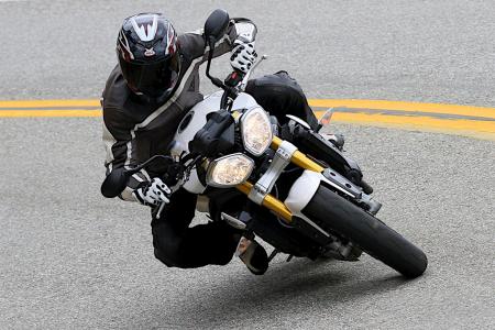 2012 triumph speed triple r review motorcycle com, Ergos on the Speed Triple R are unchanged from the standard version boasting a comfy seat and a relatively open riding position It also boasts mirrors that are actually functional unlike some of its rivals