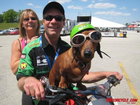 mo goes ama roadracing part 2, The paddock scene is often a great place to be especially with characters and Hall of Famers like Jay Springsteen around Here Springer is sandwiched by wife Judy and pooch Diesel