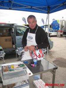 mo goes ama roadracing part 2, AMA roadracers wearing Arai helmets are treated to factory rider levels of helmet preparation Here Bruce Porter pauses momentarily from fitting tear offs for my helmet after doing the same work to Roger Hayden s