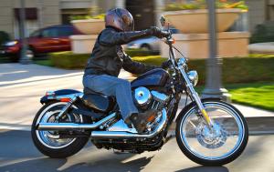 2012 harley davidson seventy two review motorcycle com, Cruising urban settings is where the Seventy Two is most at home With a comparatively tall seat height and roomy lean angle this Sportster doesn t drag footpegs as soon as many of Harley s other cruisers
