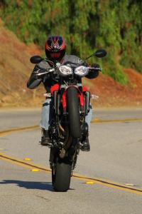 2012 triumph street triple r review motorcycle com, The STR elicits this kind of silliness whenever the opportunity presents itself