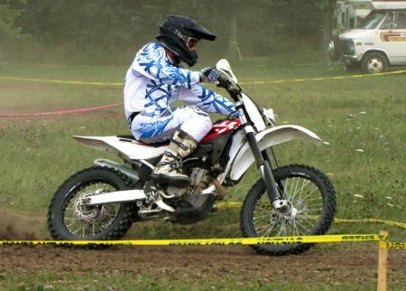 2011 husqvarna txc i250f review motorcycle com, We had fun racing our TXCi on grass tracks where the smooth powerband excellent brakes and lightweight feel helped it turn great lap times