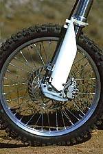 2001 suzuki rm250 motorcycle com, New Kayaba forks are now position and speed sensitive Light weight plastic guard on bottom of fork leg takes the place of last year s full rotor guard