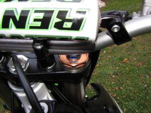 2011 kawasaki kx250f review motorcycle com, The blue hex nut on top of the right fork tube is an indexed preload adjuster We found the Showa SFF system to work very well