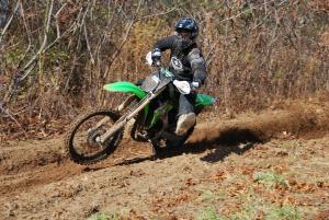 2011 kawasaki kx250f review motorcycle com, Powering out of berms is very easy on the KX250F but powershifting takes more effort than we d like