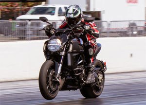 2012 ducati diavel cromo vs star vmax video motorcycle com, The Diavel launches like a rocket ship without much fear of a big wheelie