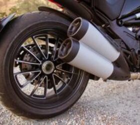 2012 ducati diavel cromo vs star vmax video motorcycle com, Attached to the Diavel s single sided swingarm is a 240mm rear tire Looks better than it handles but you get used to it