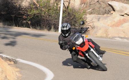 2009 bmw g650gs review motorcycle com, The littlest GS holds its own in the twisties thanks to a stable chassis however keeping the tach spinning around 6K rpm and above is necessary to keep faster riders or bigger bikes in sight