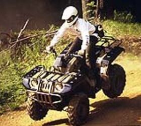 atv test 1998 yamaha grizzly 600 motorcycle com, Our rider thoughtfully dips the front so you can take a gander at the monster racks fore and aft with the largest carrying capacity available anywhere