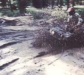 atv test 1998 yamaha grizzly 600 motorcycle com, Bog Boy plows through some unlucky mud with his Grizzly