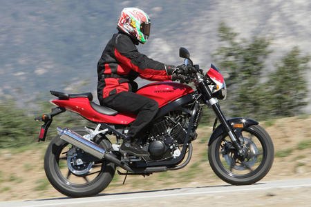 affordable riding in the new year, Whereas small displacement Japanese bikes feel toy like to average size Americans 250cc Hyosung models are constructed to full size dimensions and thus feel more substantial and comfortable to taller riders
