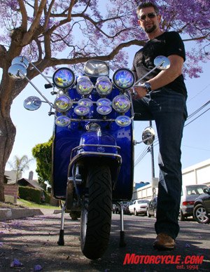 summer of scootin, Bartels 1967 electric blue Vespa Spring was restored and fitted with count em 14 lights and 5 mirrors something you d see ridden back in the 60s by the Mods who were at odds with the Rockers who rode motorcycles