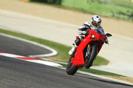 2011 ducati 1198 sp review motorcycle com, Wheelies happen without trying on the potent 1198 SP