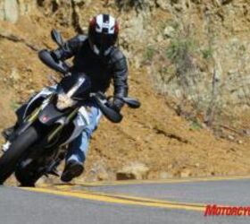 2010 aprilia dorsoduro 750 vs ducati hypermotard 796 motorcycle com, Sticking a foot out supermoto style is easy and feels natural on the Dorso or Hyper