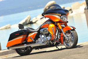 2011 harley davidson cvo street glide review motorcycle com, CVO owners aren t afraid of being bold The Glide s exclusive paint scheme is offered in four color combos each with its own specific finishes for the engine wheels and muffler end caps