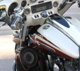 2011 harley davidson cvo street glide review motorcycle com, Six speakers and a standard iPod nano provide a premium audio experience on the road Note also the flush mount filler cap and LED fuel gauge atop the fuel tank