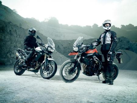 eicma 2010 preview triumph, The Triumph Tiger 800 left and the Tiger 800XC right will finally be presented at EICMA after a lengthy teaser campaign