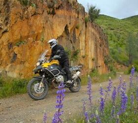 2010 bmw r1200gs and gs adventure review motorcycle com, The GS Adventure in its element This mildly challenging gravel mountain road is a cakewalk for globetrotting Adventure