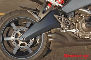 first ride 2008 buell 1125r motorcycle com, There s no black gold in this Buell swingarm Note the visual absence of the rear brake caliper