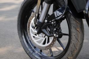 2012 ktm 200 duke review motorcycle com, A Brembo four piston front caliper bites down on a 280mm disc to bring the 200 Duke to a stop