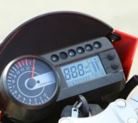 2010 hyosung gt650 review motorcycle com, The compact gauge package is of the style we prefer most an analog tach complemented by an LCD to handle the rest of the info