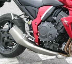 2010 honda cb1000r review motorcycle com, Styling cues for exhaust and tailpiece are borrowed from latest generation CBR1000RR The engine is sourced from previous generation RR