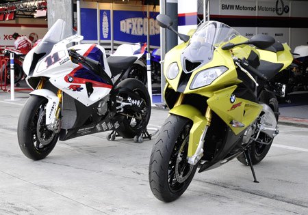 featured motorcycle brands, The BMW S1000RR at its unveiling in Monza Italy beside Troy Corser s WSBK spec version