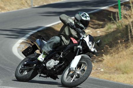 2013 husqvarna tr650 review motorcycle com, Husky s TR650 Strada is a joy to throw around on a tight sinuous road
