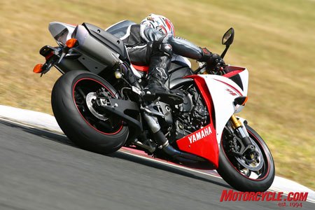 2009 yamaha r1 review motorcycle com, A large cutout in the side fairing allows hot air to escape Titanium mufflers look a bit bulky