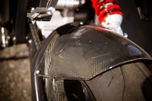 2013 brammo empulse r review video motorcycle com, Premium suspension and carbon fiber accents like this rear fender are what set the Empulse R apart from the standard Empulse