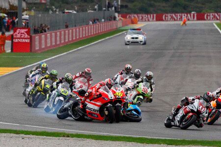 2011 motogp valencia results, Alvaro Bautista s first corner crash took out a trio of Ducatis in Nicky Hayden Valentino Rossi and Randy de Puniet