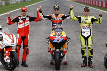 2011 motogp valencia results, 2011 MotoGP Champion Casey Stoner is flanked by Moto2 Champion Stefan Bradl left and 125cc Champion Nicolas Terol