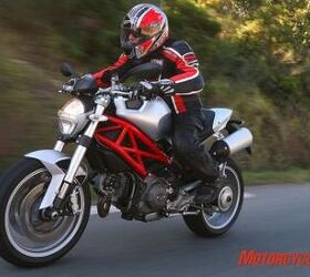 2009 ducati monster 1100 review motorcycle com, The Monster exudes a classic roadster form being both comfy and sporty