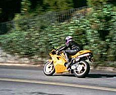 first impression 1997 ducati 748 motorcycle com, Ducati s 748 is in its element when the road turns twisty
