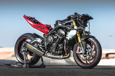 2013 triumph daytona 675r review motorcycle com, This stripped view of the 675R reveals the larger air intake scoop at the nose and more compact stainless steel exhaust Note also the accessory slip on Arrow exhaust