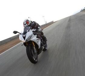 2013 triumph daytona 675r review motorcycle com, Seat height is unchanged on R bikes compared to last year but the higher clip ons and generous legroom are little changes based on customer feedback