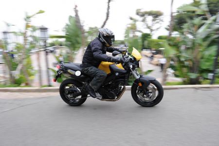2011 bmw f800r review motorcycle com, The BMW F800R is a tidy and interesting roadster Note the silver filler cap for the underseat fuel tank Three other color options are available aside from our Shine Yellow Metallic Black Silk Shining version