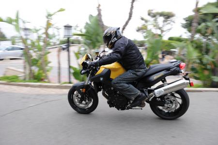2011 bmw f800r review motorcycle com, We re glad BMW is giving Americans a crack at its F800R Note the one piece seat with an expansive passenger section and nylon grab bars