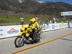 the pleasure and perils of escorting a bicycle race, A Team Support motorcycle carrying spare tires and wheels for the racers