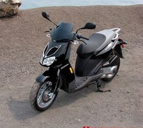 2008 aprilia sportcity 250 review motorcycle com, Sporty and aggressive you d never guess the SportCity was also affordable