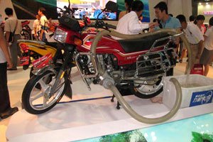 2009 chinese motorcycle show part 2, This Lifan LF150 17 with a 124cc liquid cooled engine demonstrates the utilitarian aspect of motorcycling in China as it s shown here with an optional pump to help irrigate your fields