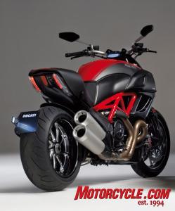 2011 ducati diavel review almost motorcycle com, The Diavel s rear view is perhaps its most striking The massive exhaust pipes and tire make for an imposing impression