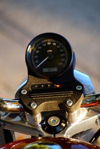 2012 harley davidson sportster superlow review motorcycle com, Instrumentation is basic but the simple speedo with inlaid LCD fits perfectly to the SuperLow s no nonsense styling ethos