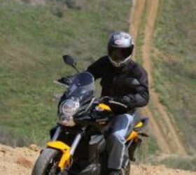 2012 kawasaki versys review motorcycle com, Long travel suspension and 17 inch wheels send a mixed message but the Versys will handily navigate the common fire road More aggressive off roading will require more enduroesque tires