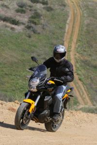 2012 kawasaki versys review motorcycle com, Long travel suspension and 17 inch wheels send a mixed message but the Versys will handily navigate the common fire road More aggressive off roading will require more enduroesque tires