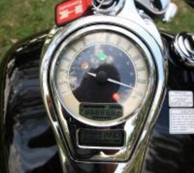 2010 kawasaki vulcan 1700 classic vs 2010 triumph thunderbird motorcycle com, The Kawi dash lacks a tachometer but the dual LCD panels offer a gear position indicator and a fuel mileage remaining feature amongst other standard information