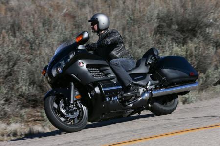 2013 honda gold wing f6b review motorcycle com, Available in either black or red the 2013 F6B also comes in a Deluxe package that features a centerstand passenger backrest heated grips and self cancelling turn signals
