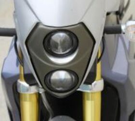 featured motorcycle brands, A bikini fairing and stacked lights accent well against the anodized inverted fork